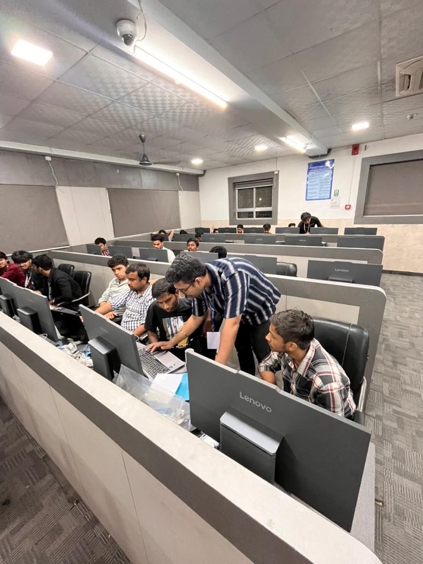 Helping a participant at a laptop